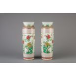 A pair of Chinese famille verte rouleau vases with floral design, 19th/20th C.