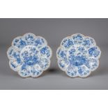 A pair of Chinese blue and white lotus shaped plates with floral design, Kangxi