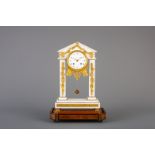 A French white marble and gilt bronze portico clock under glass dome and on a wooden base, 19th C.