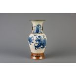 A Chinese Nanking blue and white crackle glazed vase with Buddhist lions, 19th C.