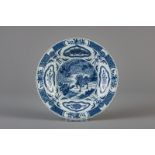 A Chinese blue and white deep 'qilin and phoenix' plate, 18/19th C.