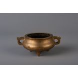 A Chinese bronze tripod censer, Qianlong mark, 19th C.