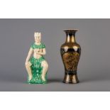 A Chinese monochrome black gilt decorated vase and a Shiwan figure, 19th C.