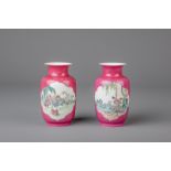 Two Chinese famille rose ruby ground vases, Yongzheng mark, 20th C.