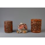 Two Chinese carved bamboo brush pots and a soapstone group with a laughing Buddha, 19th/20th C.