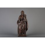 A large carved wood figure of the Virgin and Child with traces of polychromy, Flanders, 17th C.