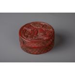 A Chinese carved cinnabar lacquer circular box and cover with scholars, 19th C.