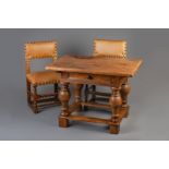 A Flemish oak and walnut rent table with two accompanying chairs, 17th C.