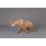A polychrome decorated terracotta elephant, 20th C.