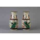 A pair of Chinese Nanking famille verte crackle glazed vases, 19th C.