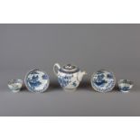 A Chinese blue, white and gilt teapot and cover and a pair of cups and saucers, Qianlong
