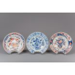Two Chinese blue and white and Imari style barber's bowls and a Japanese Imari shaving bowl, 18th C.