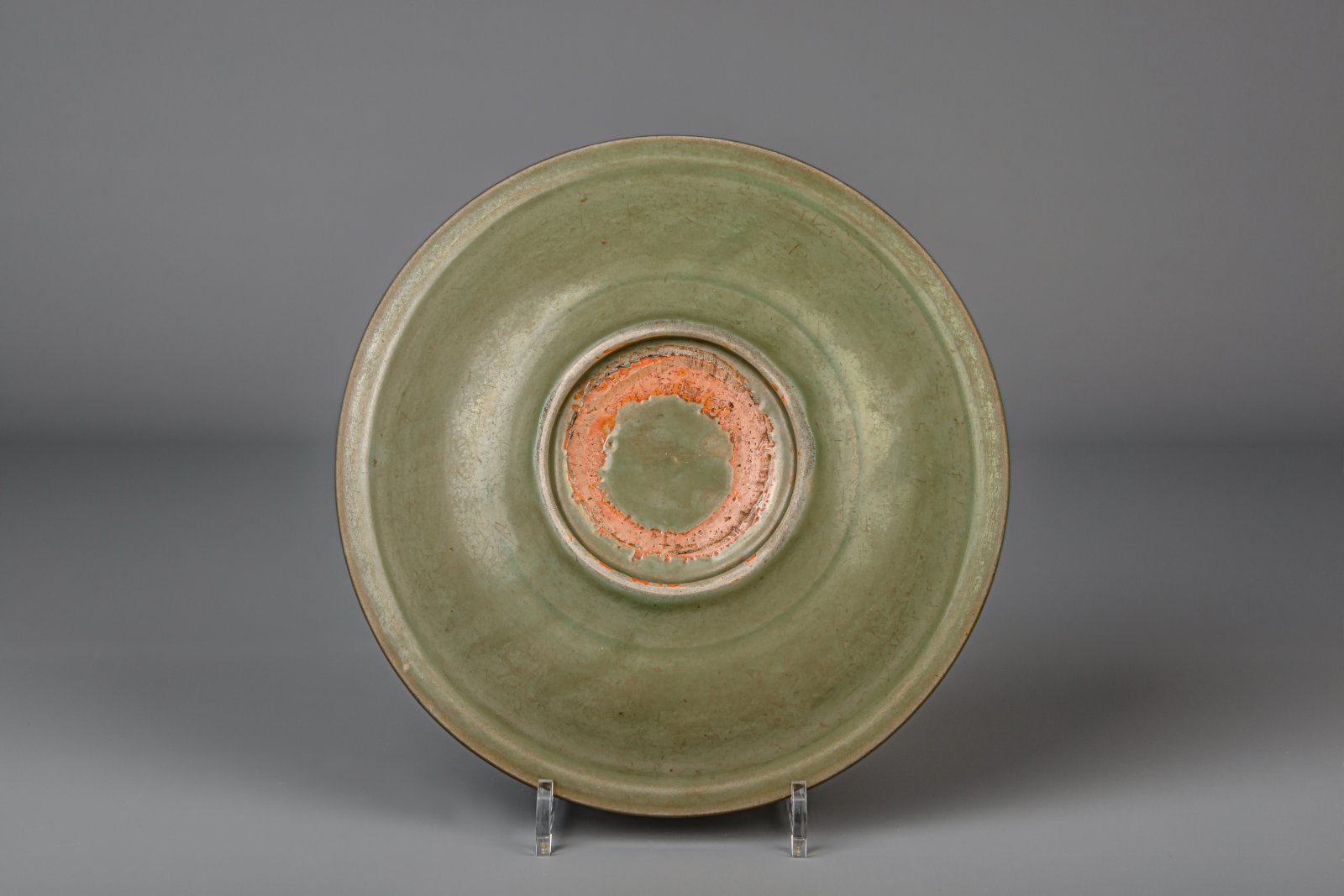 A Chinese Longquan celadon dish with floral underglaze design, Ming - Image 3 of 3
