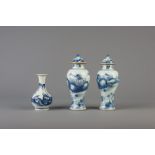 A pair of Chinese blue and white vases and covers and a blue and white bottle vase, 18/19th C.