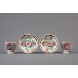 A pair of reticulated double-walled Chinese famille rose cups and saucers, Yongzheng/Qianlong
