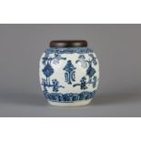 A Chinese blue and white ginger jar with floral design and a wooden cover, Kangxi