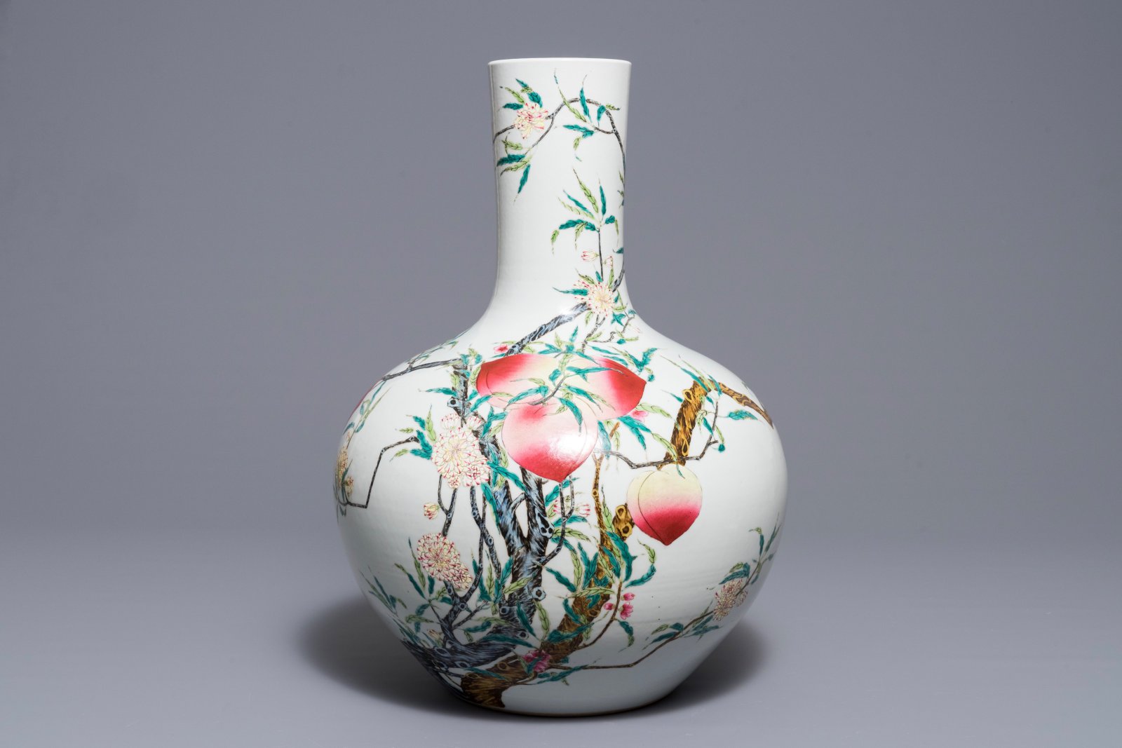 A Chinese famille rose "nine peaches" vase, Qianlong mark, 20th C.