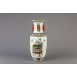 A Chinese famille rose vase with flowers and antiquities, 19th C.