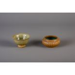 A Chinese narcissus shaped flambŽ glazed bowl and a green glazed bowl on foot, Song/Yuan