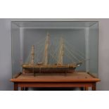 A painted wood model of the ship 'Cutty Sark' with glass case, 20th C.