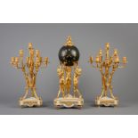 A large three-piece gilt bronze and white marble 'Three Graces' clock garniture, France, 19th C.