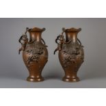Hippolyte Franois Moreau (1832-1927): A pair of bronze vases with putti and nymphs, France