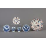 A pair of Chinese blue and white cups and saucers and an Imari style dish and saucer, 18th/19th C.