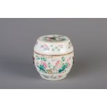 A Chinese famille rose jar and cover with floral design, 19th C.