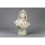 A polychrome decorated biscuit bust of a young lady, Royal Dux, Art Nouveau, early 20th C.