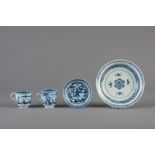 A Chinese blue and white 'bats and shou' plate, two cups and a saucer, Kangxi and 19th C.
