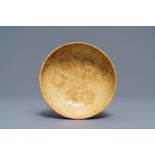 A Chinese pottery bowl with incised floral design, Tang
