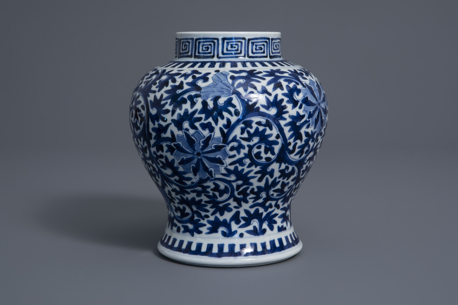A Chinese blue and white baluster vase with floral design, Kangxi mark, 19th C. - Image 2 of 7