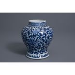 A Chinese blue and white baluster vase with floral design, Kangxi mark, 19th C.