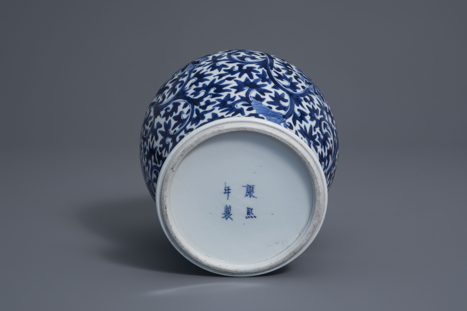 A Chinese blue and white baluster vase with floral design, Kangxi mark, 19th C. - Image 7 of 7