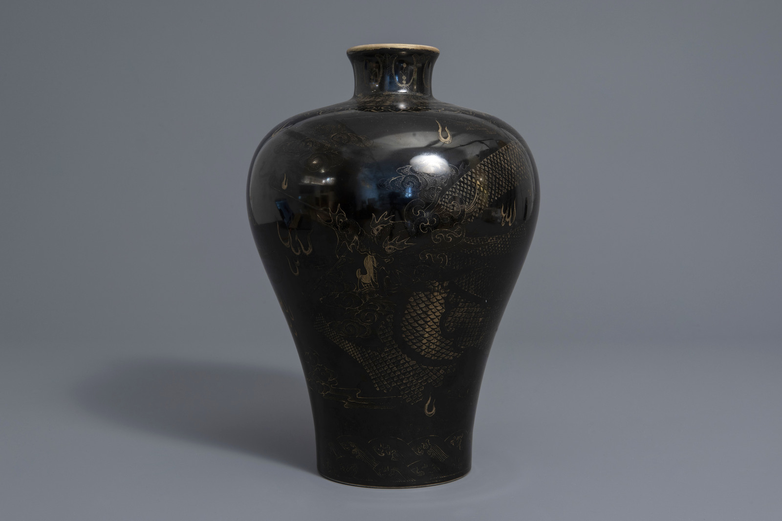 A Chinese black ground vase with a gilt dragon chasing the pearl, Qianlong mark, 19th C. - Image 2 of 7