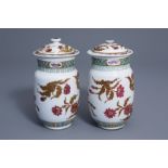 A pair of Chinese famille rose vases and covers with floral design, 19th C.