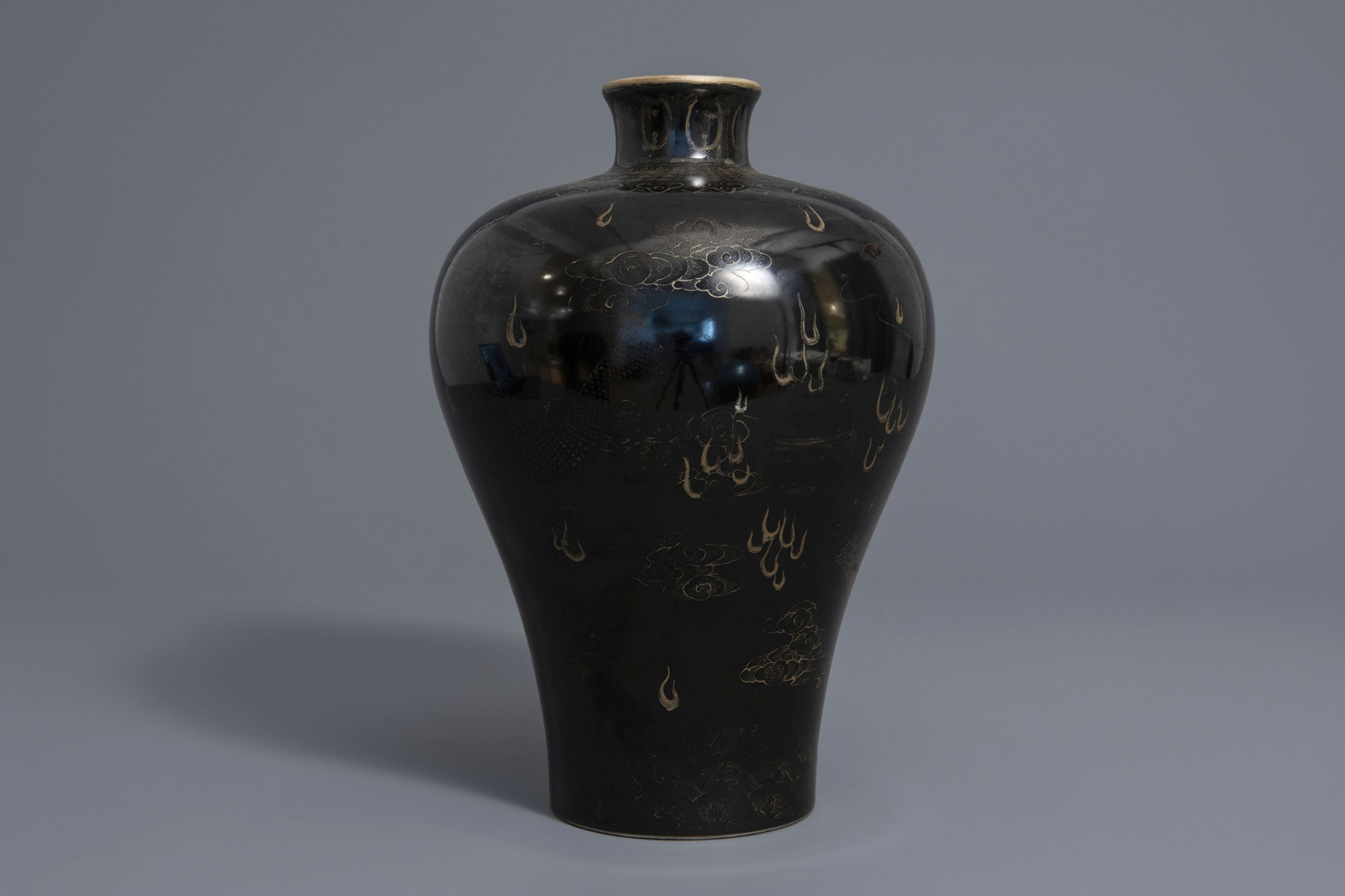 A Chinese black ground vase with a gilt dragon chasing the pearl, Qianlong mark, 19th C. - Image 3 of 7