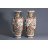 A pair of massive Japanese Satsuma vases with figural design, Meiji, 19th C.