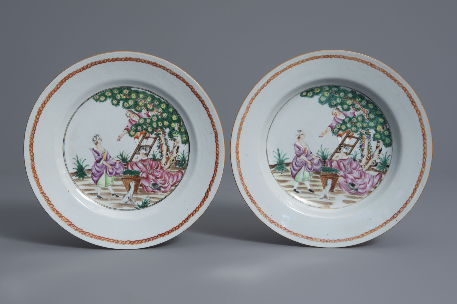 A pair of Chinese famille rose export porcelain 'Cherry Pickers' plates, Qianlong