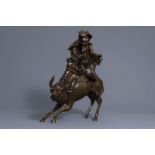 A large Japanese bronze group depicting Laozi on a water buffalo, Meiji, 19th/20th C.