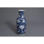 A Chinese blue and white rouleau vase with prunus on cracked ice, 19th C.