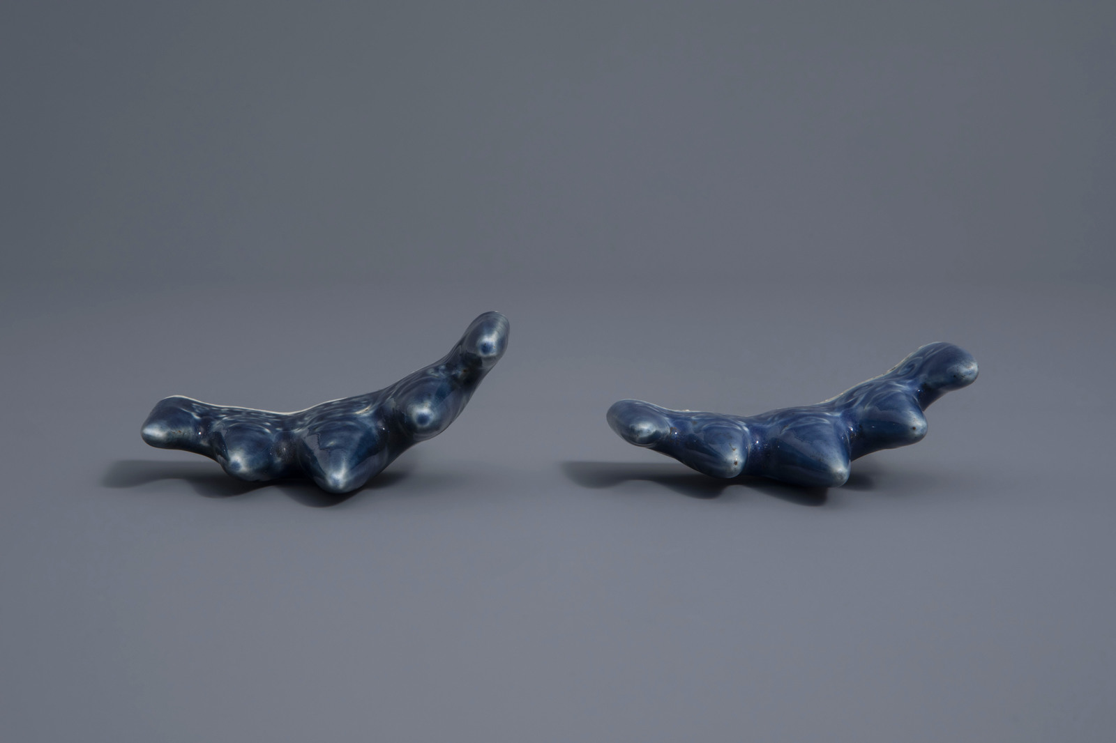 A pair of Chinese monochrome blue brush rests with underglaze design, 19th/20th C. - Image 6 of 7