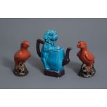 A Chinese turquoise & aubergine glazed Buddhist lion teapot and a pair of red parrots, 20th C.