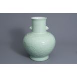 A large Chinese monochrome celadon floral relief decorated vase, Qianlong mark, 19th/20th C.