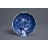 A Chinese blue & white saucer dish with prunus, Yongzheng mark and period