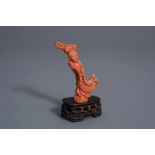 A Chinese carved red coral figure of a lady, 19th/20th C.