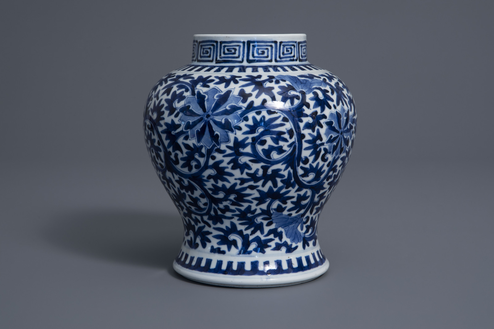 A Chinese blue and white baluster vase with floral design, Kangxi mark, 19th C. - Image 5 of 7