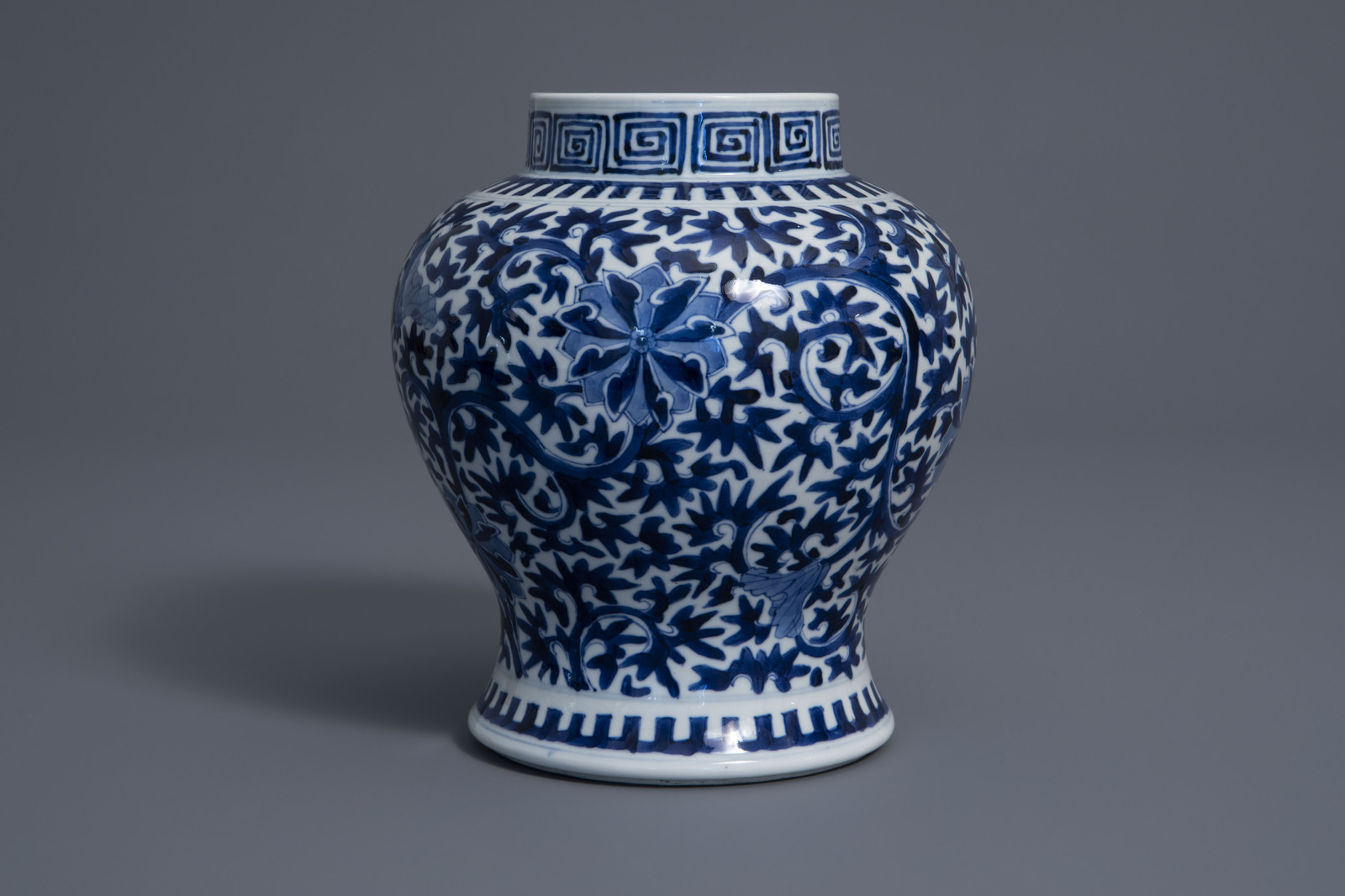 A Chinese blue and white baluster vase with floral design, Kangxi mark, 19th C. - Image 3 of 7