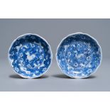 A pair of Chinese blue & white 'galloping horse' saucers, Jiajing mark, prob. Kangxi