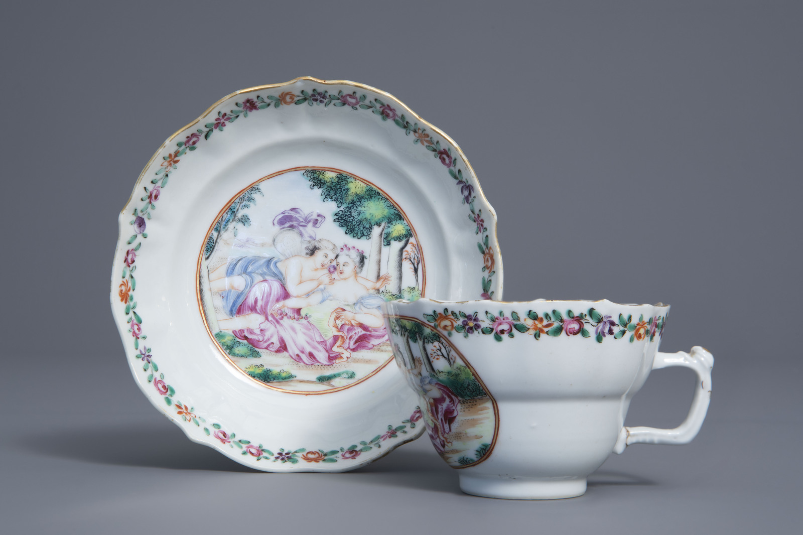 A Chinese famille rose export 'Flora and Zephyr' cup and saucer, Qianlong